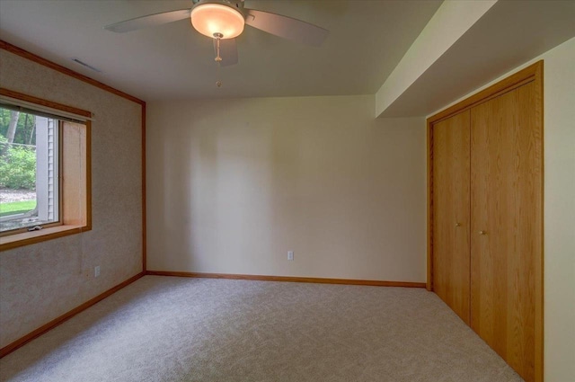3 Deer Point Trl, Madison, WI 53719 - unfurnished bedroom featuring carpet floors, a closet, and a ceiling fan