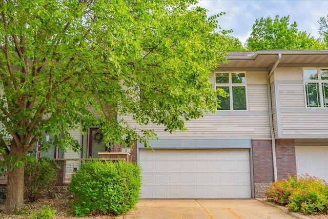 3 Deer Point Trl, Madison, WI 53719 - view of front facade featuring a garage, driveway, and brick siding