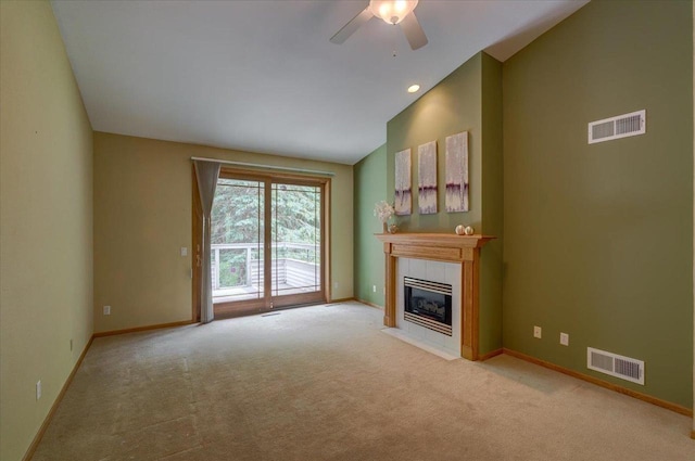 3 Deer Point Trl, Madison, WI 53719 - unfurnished living room with a tiled fireplace, a ceiling fan, light colored carpet, and lofted ceiling