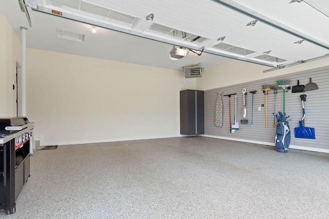 1386 Overlook Cir, Hartland, WI 53029 - garage with a garage door opener and baseboards
