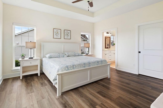 1386 Overlook Cir, Hartland, WI 53029 - bedroom with dark wood-style floors, connected bathroom, and a ceiling fan