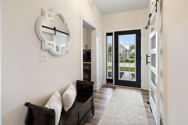 1386 Overlook Cir, Hartland, WI 53029 - entrance foyer featuring a barn door, dark wood-style flooring, and wine cooler