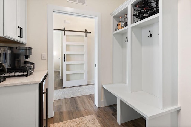1386 Overlook Cir, Hartland, WI 53029 - mudroom with a barn door and dark wood finished floors