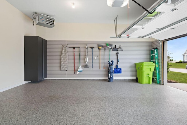1386 Overlook Cir, Hartland, WI 53029 - garage featuring a garage door opener and a heating unit