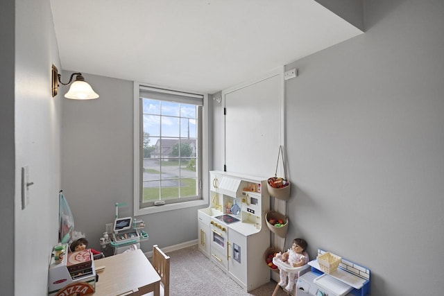 3223 55th Ct Unit 65, Kenosha, WI 53144 - game room featuring light carpet and baseboards