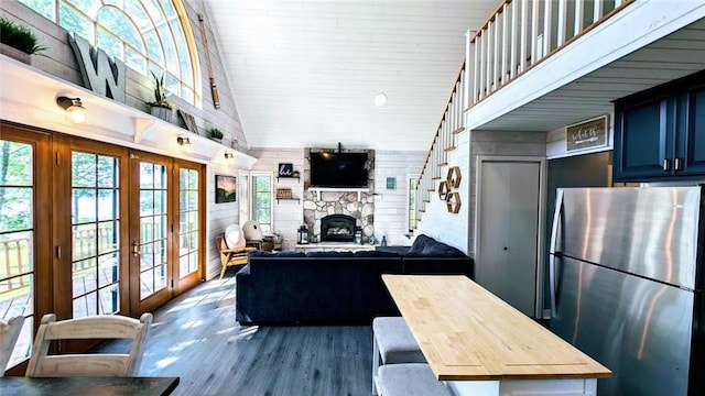 W6741 Lakewood Blvd, Ladysmith, WI 54848 - living area with french doors, a fireplace, dark wood-type flooring, and a high ceiling