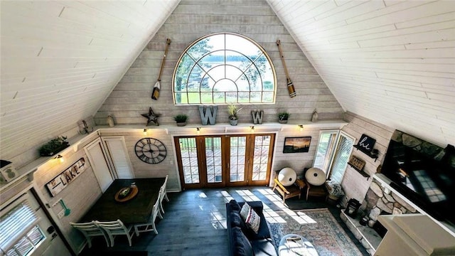 W6741 Lakewood Blvd, Ladysmith, WI 54848 - living room featuring vaulted ceiling, wooden walls, and wood finished floors