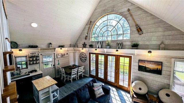 W6741 Lakewood Blvd, Ladysmith, WI 54848 - living room featuring wooden walls, plenty of natural light, french doors, and high vaulted ceiling