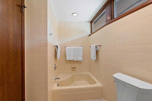 1225 W Cedar St, Appleton, WI 54914 - bathroom with tile walls and shower / washtub combination