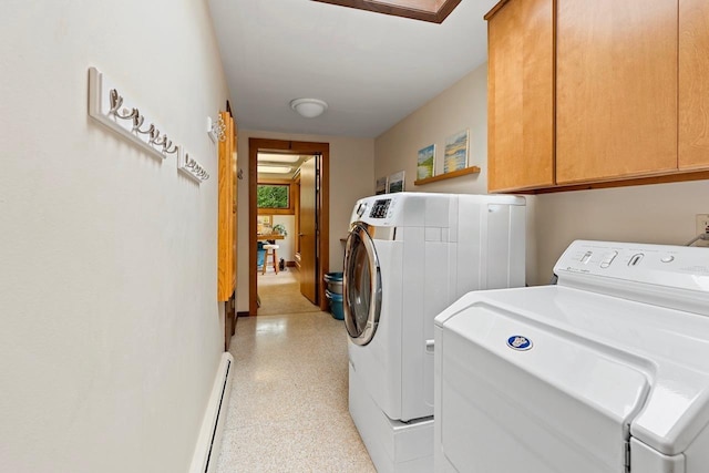 1225 W Cedar St, Appleton, WI 54914 - washroom with separate washer and dryer, cabinet space, and a baseboard heating unit