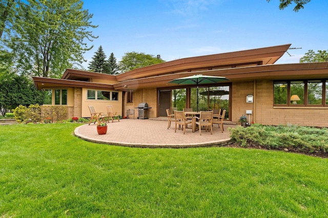 1225 W Cedar St, Appleton, WI 54914 - back of house with a yard and a patio