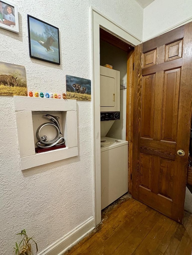 4110 N 7th St, Milwaukee, WI 53209 - laundry room featuring stacked washing machine and dryer, dark wood-style floors, and a textured wall