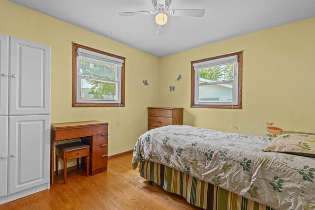 931 W Lindbergh St, Appleton, WI 54914 - bedroom with multiple windows, light wood-style flooring, and a ceiling fan