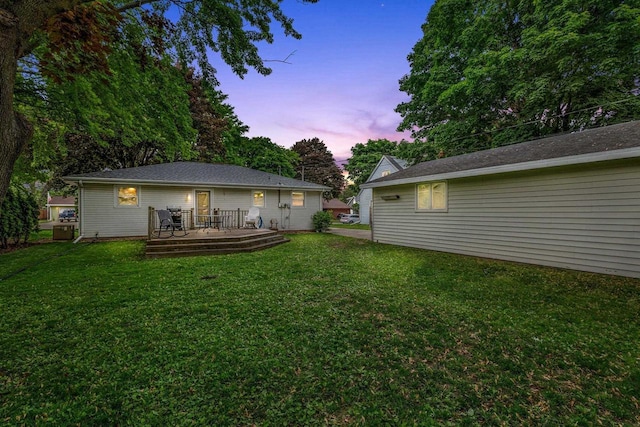 931 W Lindbergh St, Appleton, WI 54914 - rear view of house featuring a wooden deck and a yard
