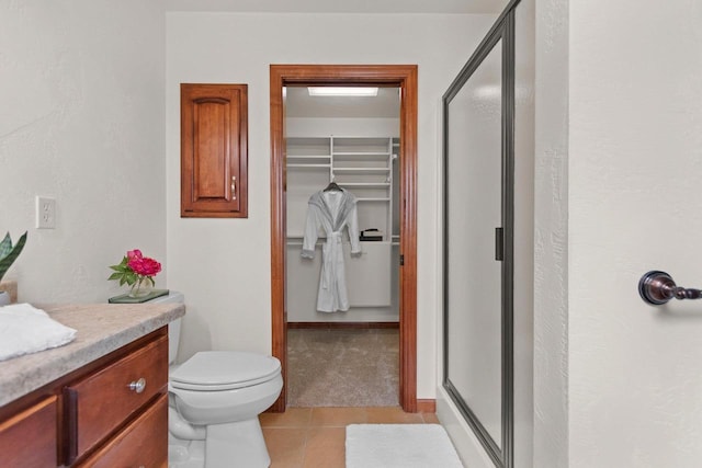52 Penbrook Cir Unit 47, Appleton, WI 54911 - full bath with a shower stall, a walk in closet, tile patterned floors, and vanity