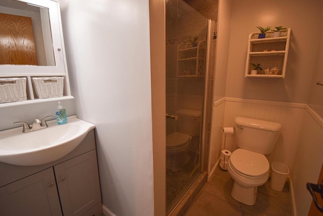 1135 W Walworth Ave, Whitewater, WI 53190 - bathroom with vanity, a shower stall, a wainscoted wall, and tile patterned flooring
