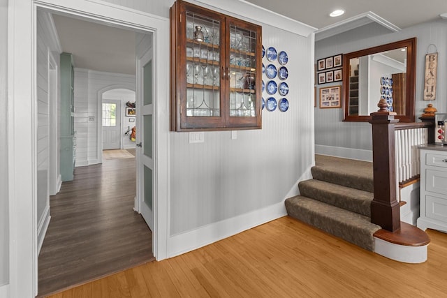 8823 406th Ave, Genoa City, WI 53128 - corridor featuring arched walkways, wood finished floors, ornamental molding, and stairs