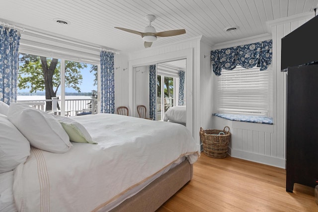 8823 406th Ave, Genoa City, WI 53128 - bedroom with ornamental molding, access to outside, a water view, wood finished floors, and ceiling fan