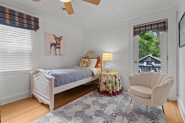 8823 406th Ave, Genoa City, WI 53128 - bedroom featuring access to outside, wood finished floors, a ceiling fan, wooden ceiling, and crown molding