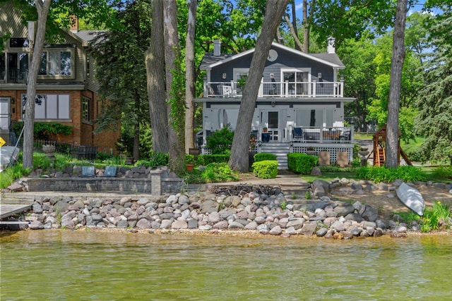 8823 406th Ave, Genoa City, WI 53128 - back of property with a balcony, a chimney, a water view, and stairway