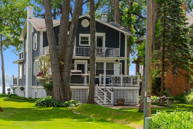 8823 406th Ave, Genoa City, WI 53128 - view of front facade featuring a balcony, a front yard, a chimney, and stairs