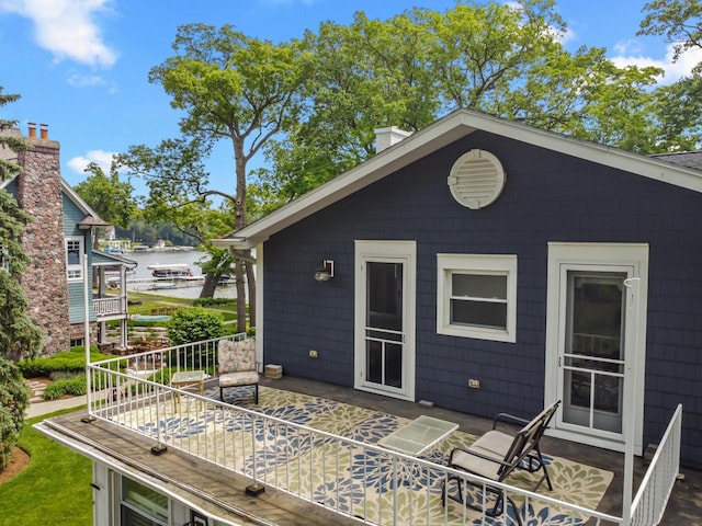 8823 406th Ave, Genoa City, WI 53128 - wooden deck with a water view and a patio