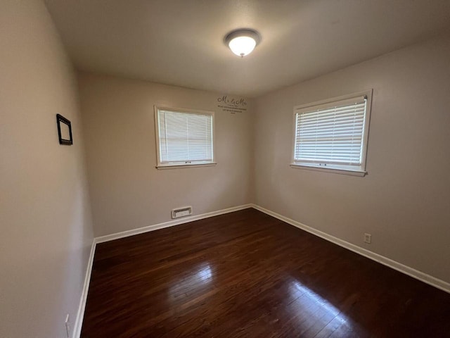3668 S 79th St, Milwaukee, WI 53220 - spare room with baseboards and dark wood finished floors