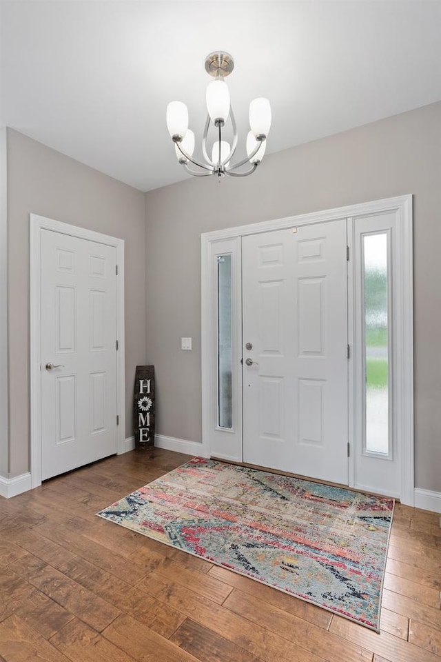 4790 Innovation Dr, Deforest, WI 53532 - foyer entrance featuring a chandelier and wood finished floors