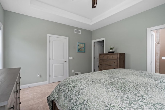 4790 Innovation Dr, Deforest, WI 53532 - bedroom featuring light colored carpet, a raised ceiling, and ceiling fan