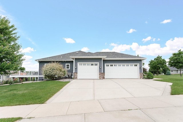 4790 Innovation Dr, Deforest, WI 53532 - view of front of home with a garage, concrete driveway, and stone siding