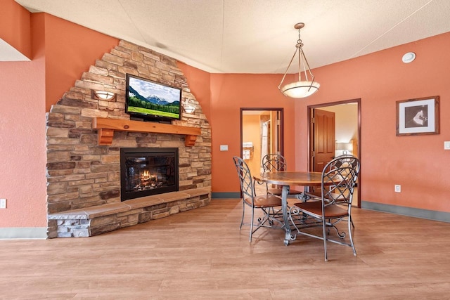 2411 River Rd Unit 2311, Wisconsin Dells, WI 53965 - dining space featuring a fireplace and wood finished floors