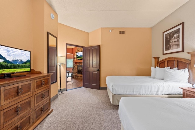 2411 River Rd Unit 2311, Wisconsin Dells, WI 53965 - bedroom with light colored carpet and a stone fireplace
