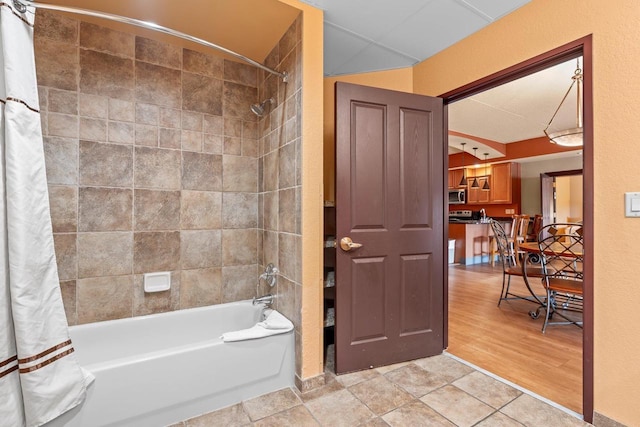 2411 River Rd Unit 2311, Wisconsin Dells, WI 53965 - bathroom featuring shower / bath combo with shower curtain and wood finished floors