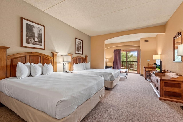 2411 River Rd Unit 2311, Wisconsin Dells, WI 53965 - carpeted bedroom with access to outside and a textured ceiling