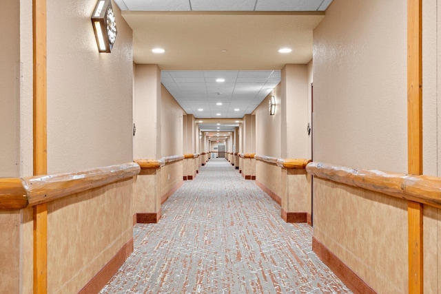 2411 River Rd Unit 2311, Wisconsin Dells, WI 53965 - hallway with a drop ceiling, recessed lighting, a textured wall, and carpet floors