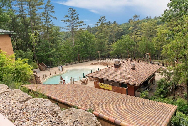 2411 River Rd Unit 2311, Wisconsin Dells, WI 53965 - outdoor pool with a forest view and a patio area