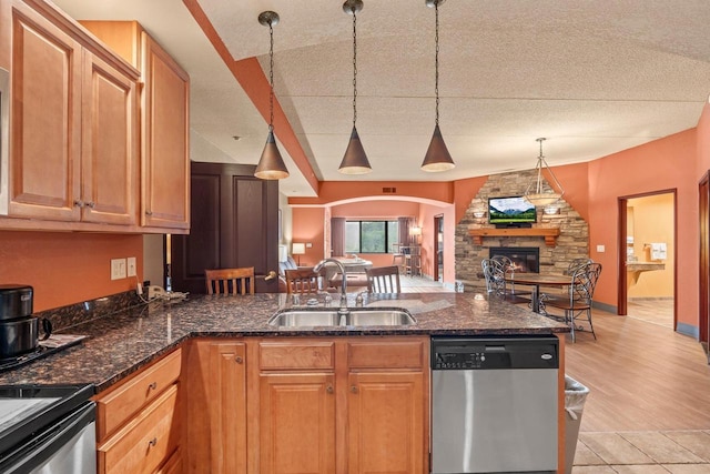 2411 River Rd Unit 2311, Wisconsin Dells, WI 53965 - kitchen with dishwasher, arched walkways, open floor plan, a peninsula, and hanging light fixtures
