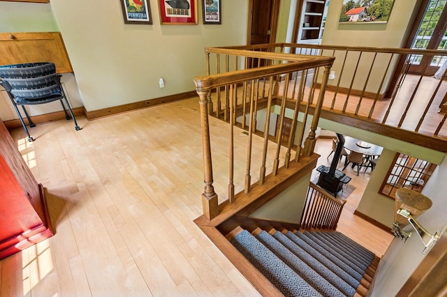 1124 Garrett Bay Rd, Ellison Bay, WI 54210 - stairway featuring wood finished floors and baseboards