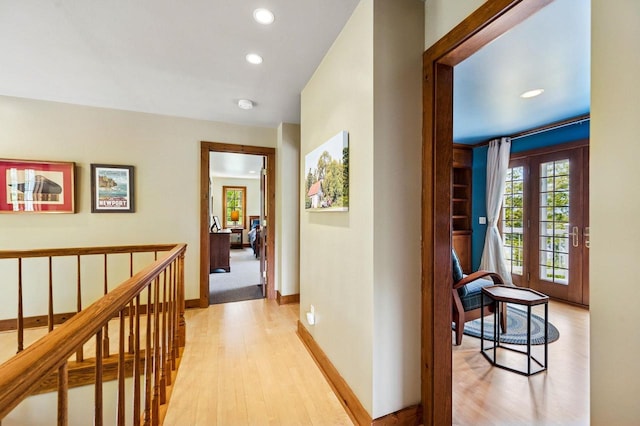1124 Garrett Bay Rd, Ellison Bay, WI 54210 - hallway featuring light wood finished floors, recessed lighting, and an upstairs landing