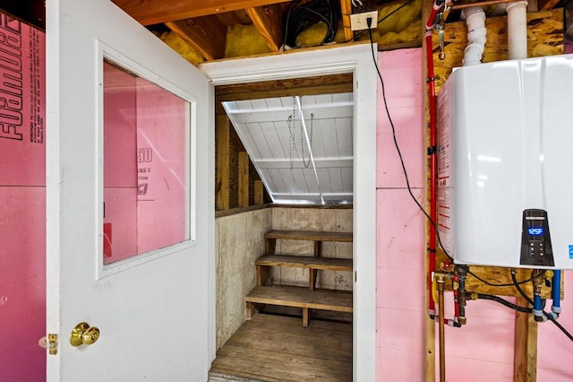 1124 Garrett Bay Rd, Ellison Bay, WI 54210 - stairs featuring tankless water heater