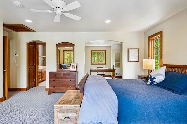 1124 Garrett Bay Rd, Ellison Bay, WI 54210 - bedroom featuring arched walkways, multiple windows, carpet, recessed lighting, and ceiling fan