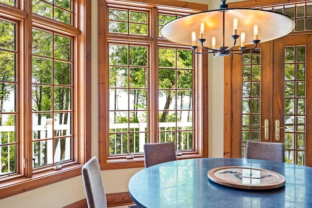 1124 Garrett Bay Rd, Ellison Bay, WI 54210 - dining space featuring a chandelier and french doors