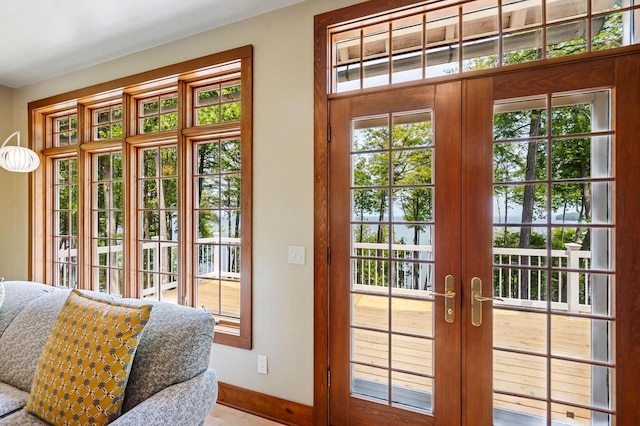1124 Garrett Bay Rd, Ellison Bay, WI 54210 - doorway with french doors and baseboards