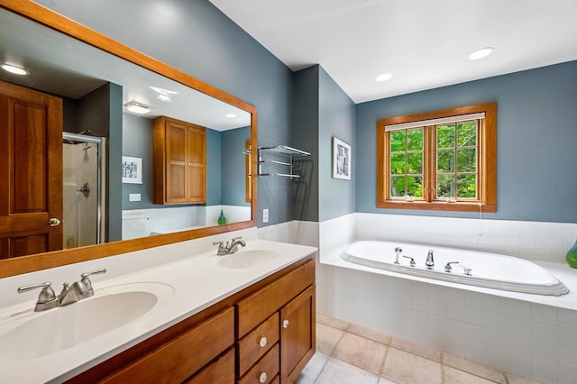 1124 Garrett Bay Rd, Ellison Bay, WI 54210 - bathroom with a bath, tile patterned floors, a shower stall, double vanity, and recessed lighting
