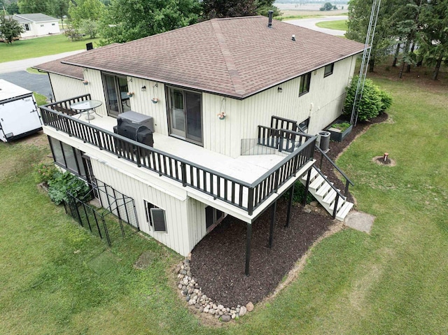 N9695 Willard Rd, Berlin, WI 54923 - back of property featuring a shingled roof, a deck, and a yard