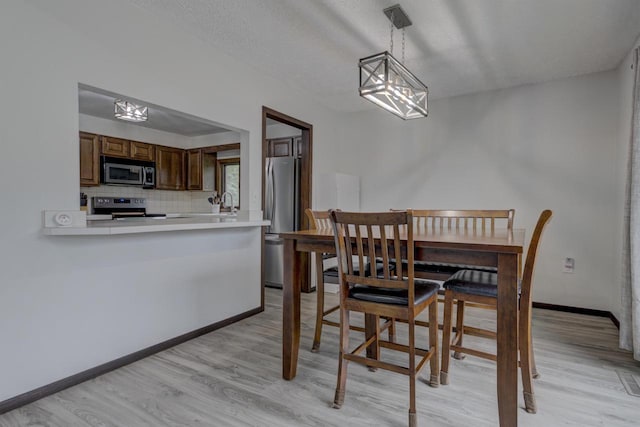 N9695 Willard Rd, Berlin, WI 54923 - dining space with light wood-style floors and a chandelier
