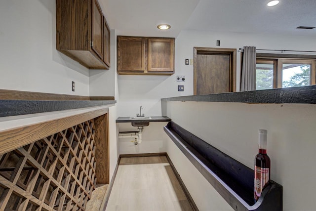 N9695 Willard Rd, Berlin, WI 54923 - laundry room with wet bar, wood finished floors, and recessed lighting