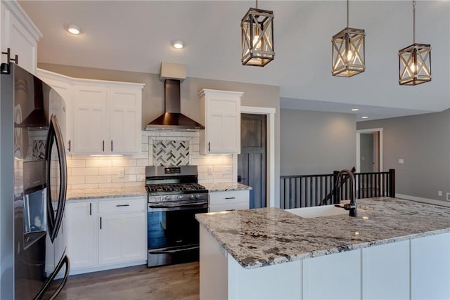 397 Candy Ln, River Falls, WI 54022 - kitchen featuring refrigerator with ice dispenser, stainless steel range with gas cooktop, wall chimney range hood, decorative backsplash, and white cabinetry