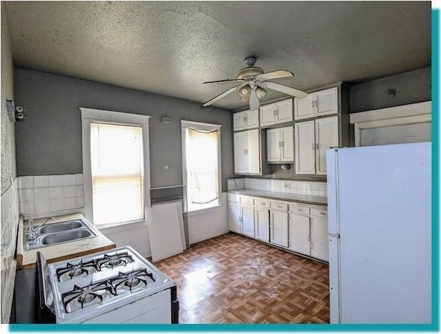 3623 N 1st St Unit 3623A, Milwaukee, WI 53212 - kitchen featuring white appliances, white cabinetry, a ceiling fan, a textured ceiling, and light countertops