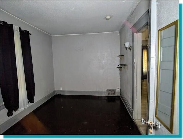 3623 N 1st St Unit 3623A, Milwaukee, WI 53212 - unfurnished room with crown molding, a smoke detector, and a textured ceiling